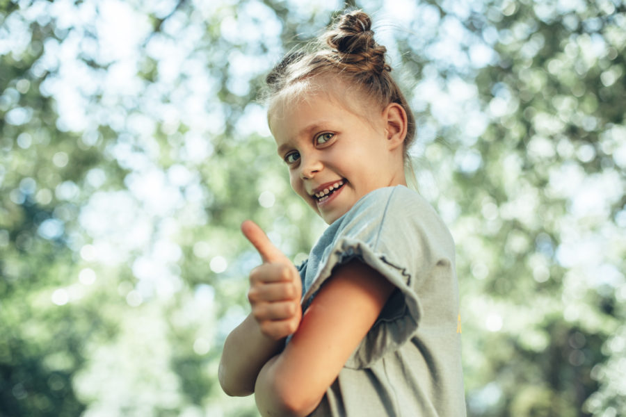 Little kid spending time with pleasure outside